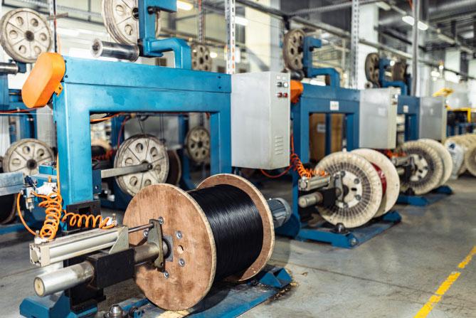 Cable winding line on an industrial production floor.